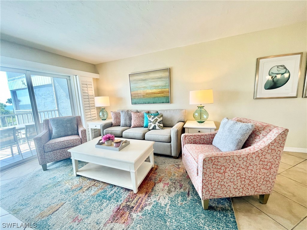 2521 Beach Villas Captiva, FL 33924 - Photo 7 of 50 a living room with furniture and a rug