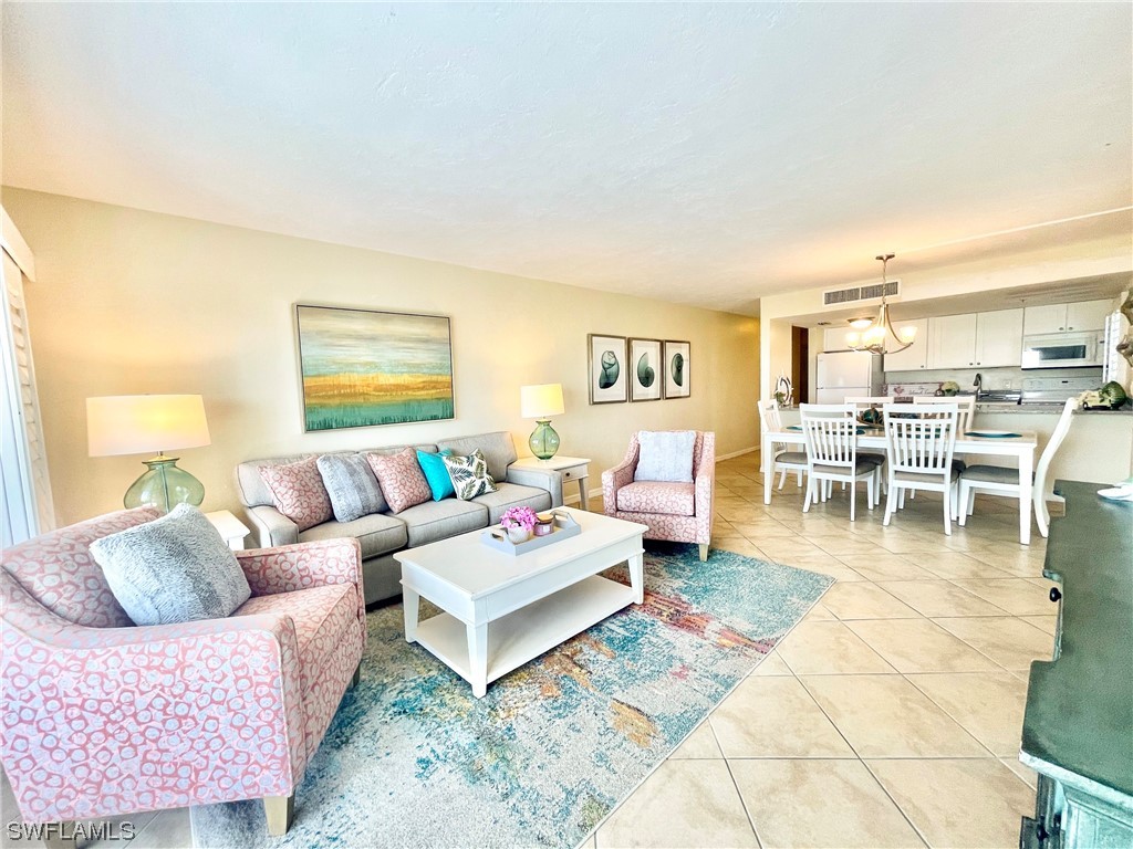 2521 Beach Villas Captiva, FL 33924 - Photo 9 of 50 a living room with furniture and view of kitchen