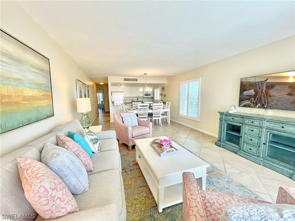 2521 Beach Villas Captiva, FL 33924 - Photo 10 of 50 a living room with furniture and a flat screen tv