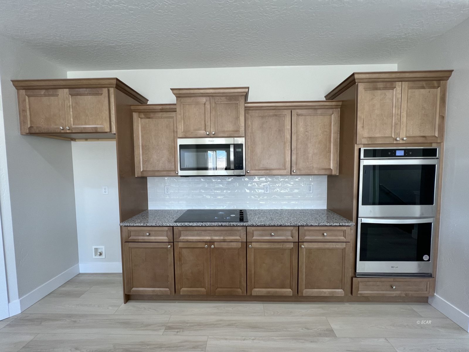 518 Ridgeway Drive Spring Creek, NV 89815 - Photo 16 of 37 a kitchen with stainless steel appliances granite countertop a stove a microwave and a refrigerator