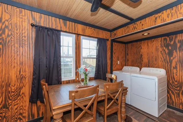 a dining room with furniture and window