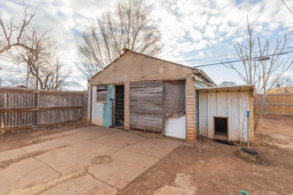 a view of a house with a yard and garage