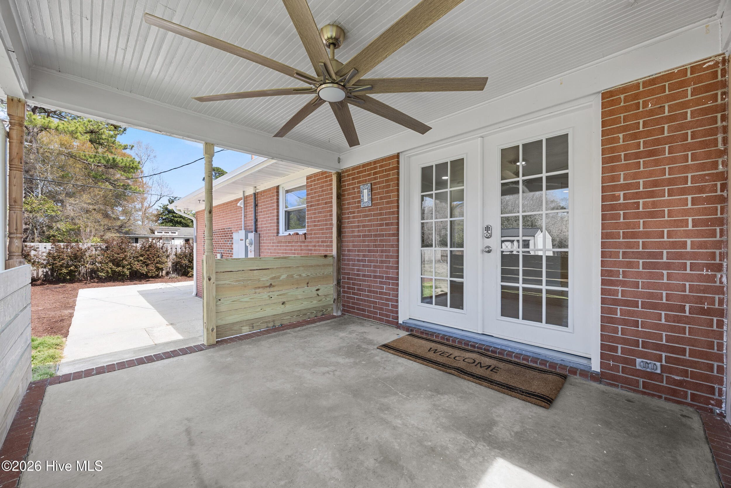 1702 Lincoln Road Wilmington, NC 28403 - Photo 30 of 45 back porch with fan and access to large yard!