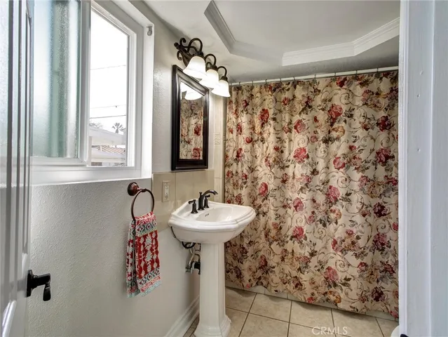 a bathroom with a sink toilet and mirror