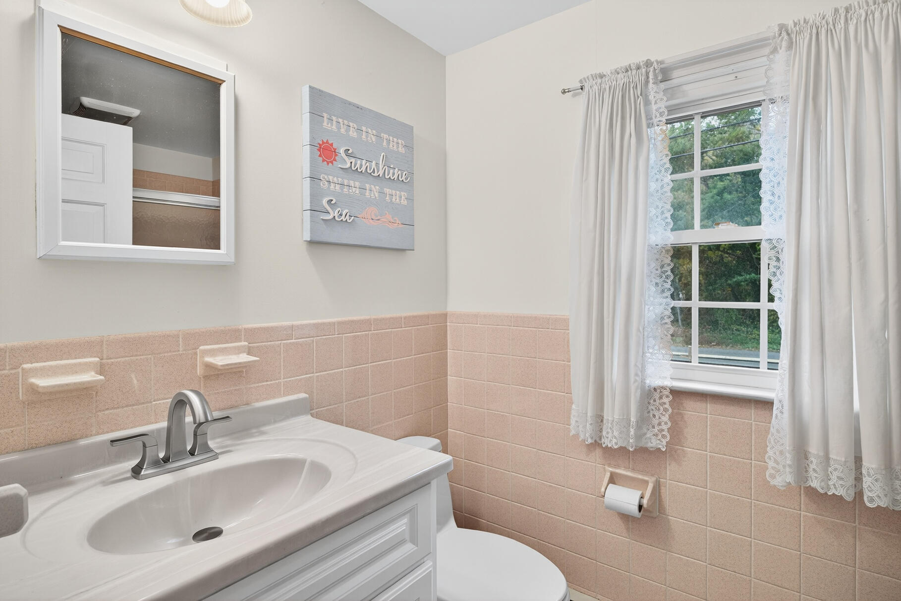 19-25 Whig Street Dennis, MA 02638 - Photo 34 of 42 a bathroom with a sink mirror and a toilet