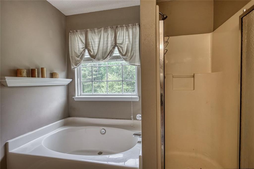 1916 Brenda Street Statham, GA 30666 - Photo 15 of 21 a white bath tub sitting next to a window