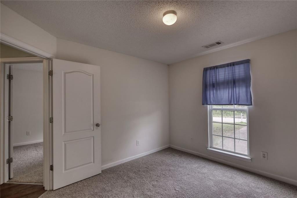 1916 Brenda Street Statham, GA 30666 - Photo 18 of 21 an empty room with windows