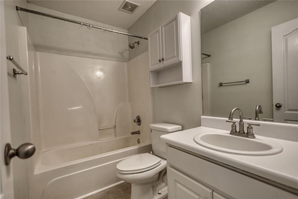 1916 Brenda Street Statham, GA 30666 - Photo 19 of 21 a bathroom with a sink toilet and shower
