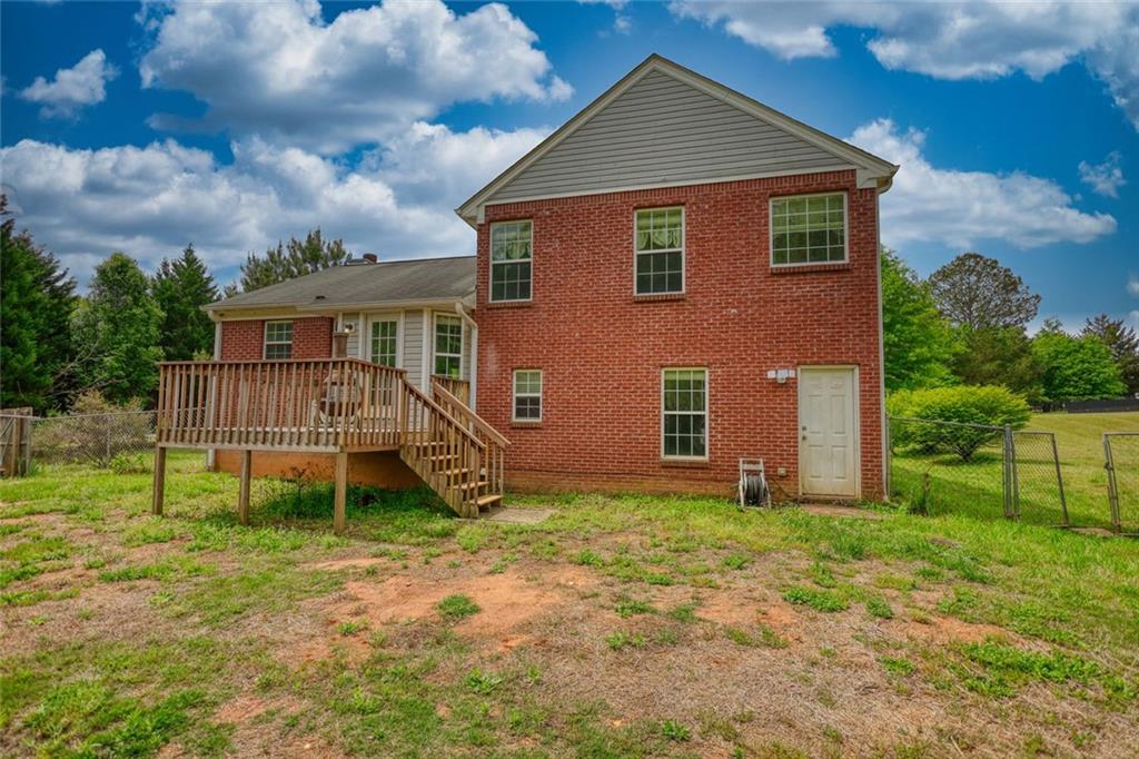1916 Brenda Street Statham, GA 30666 - Photo 20 of 21 a backyard of a house with table and chairs