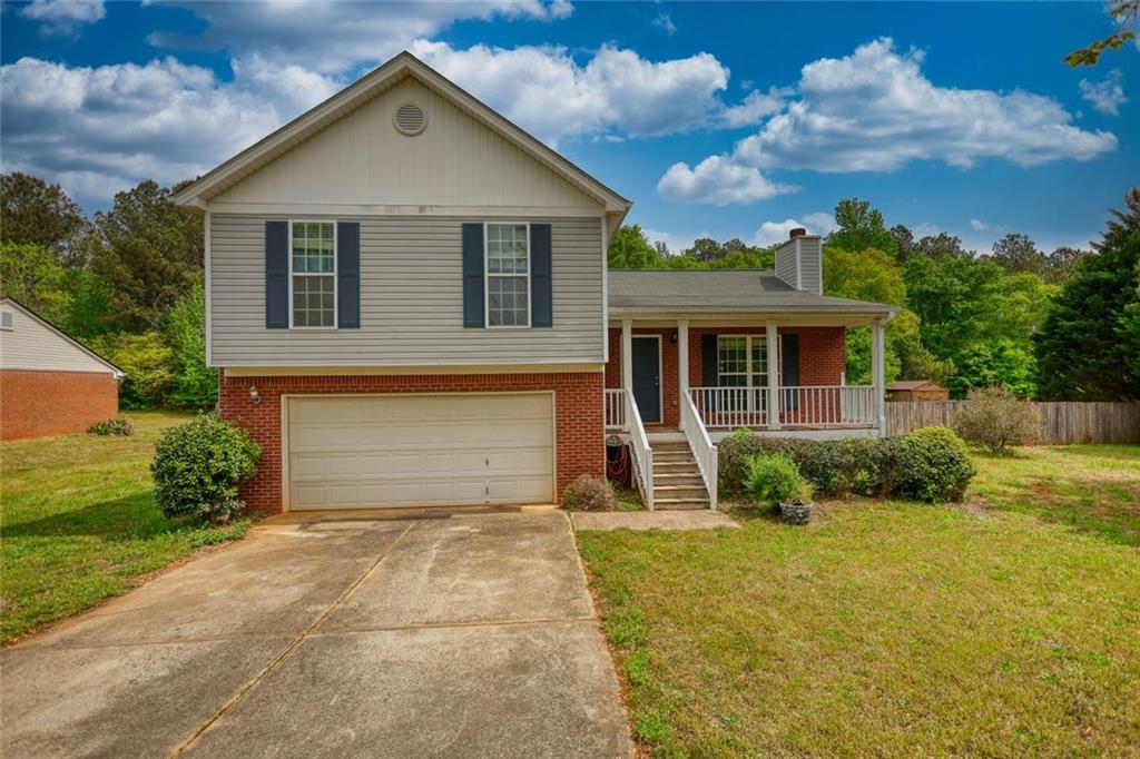 1916 Brenda Street Statham, GA 30666 - Photo 2 of 21 a front view of a house with garden