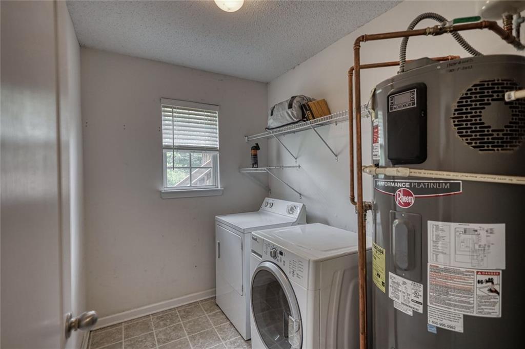 1916 Brenda Street Statham, GA 30666 - Photo 9 of 21 a view of storage and utility room with washer and dryer