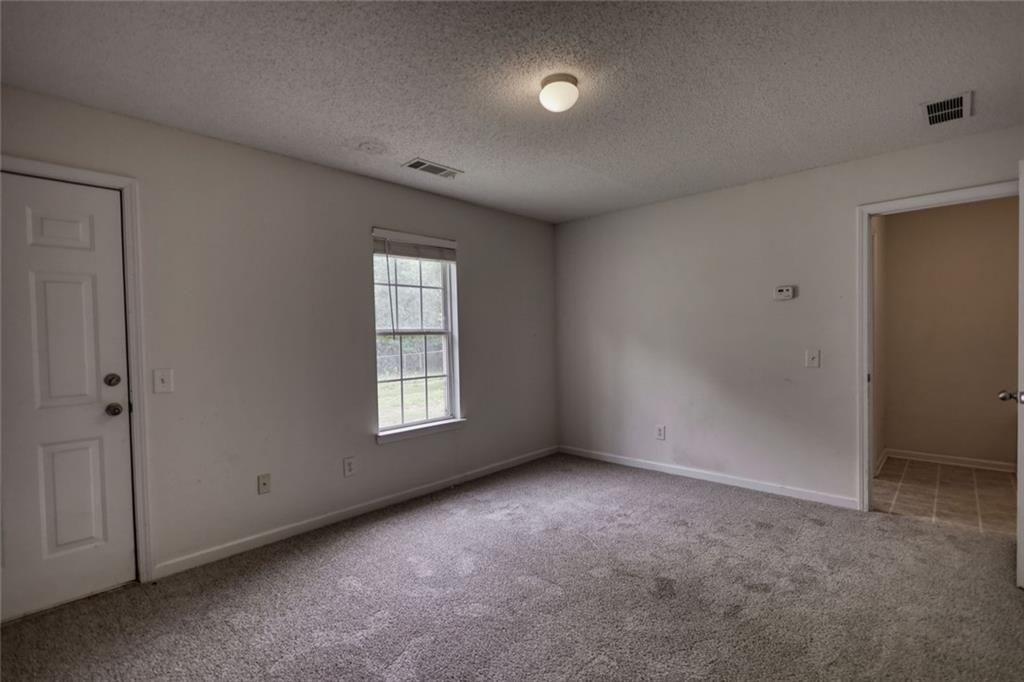 1916 Brenda Street Statham, GA 30666 - Photo 10 of 21 a view of an empty room with a window
