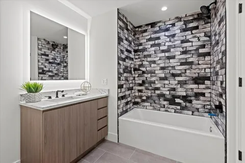a bathroom with a bathtub and a sink