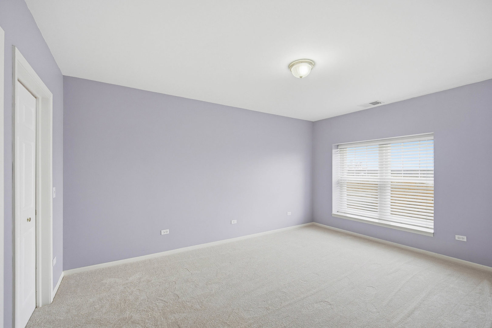 390 West Mahogany Court, Unit 606 Palatine, IL 60067 - Photo 13 of 27 an empty room with windows