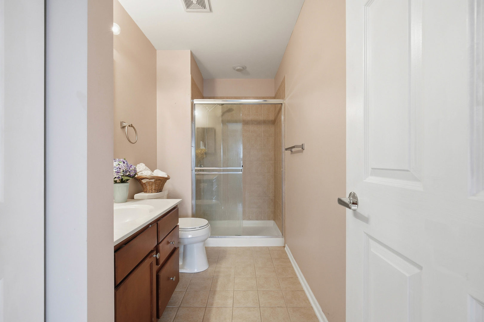 390 West Mahogany Court, Unit 606 Palatine, IL 60067 - Photo 16 of 27 a bathroom with a sink a toilet and shower