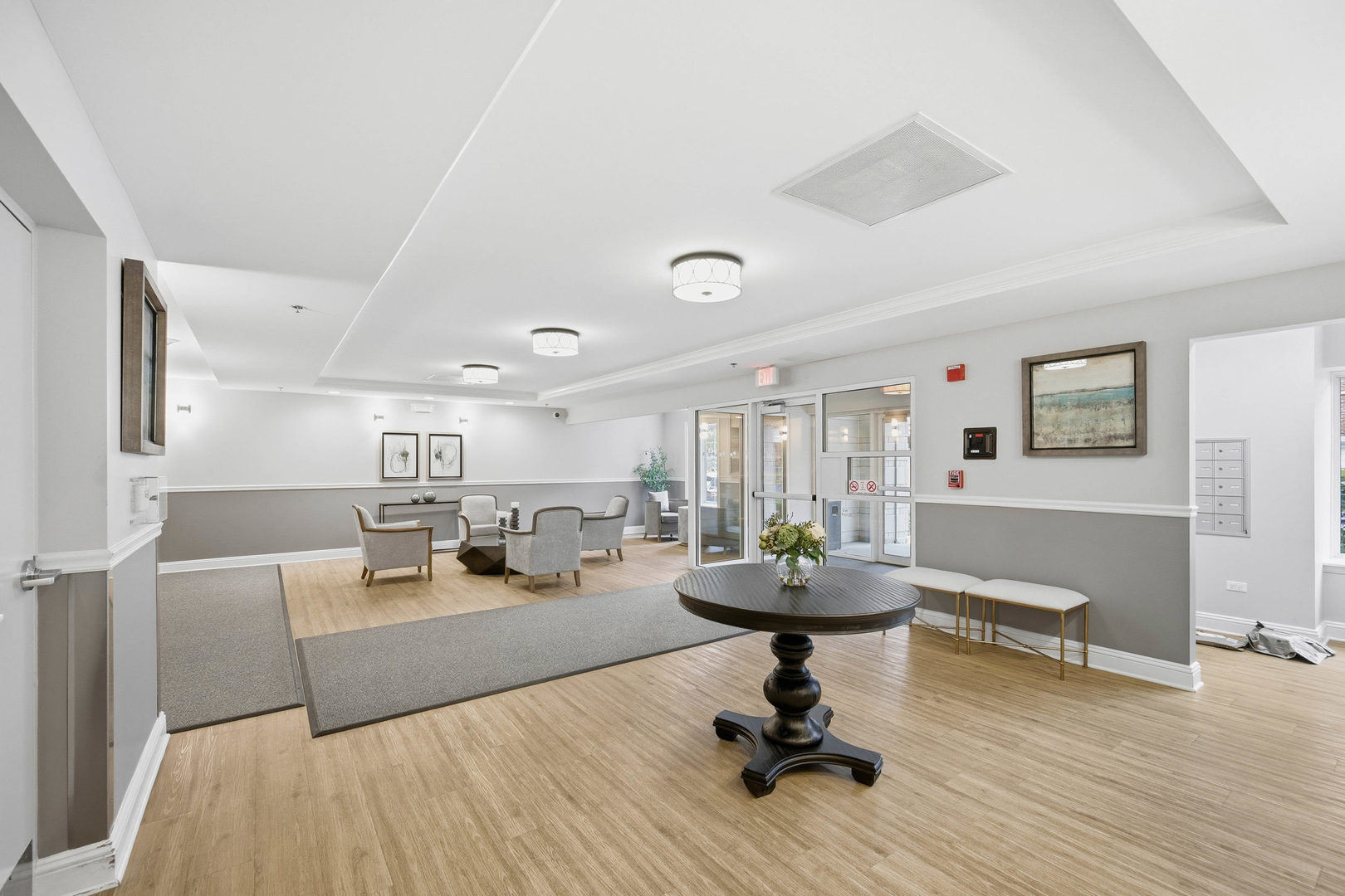 390 West Mahogany Court, Unit 606 Palatine, IL 60067 - Photo 26 of 27 a living room with furniture and a wooden floor