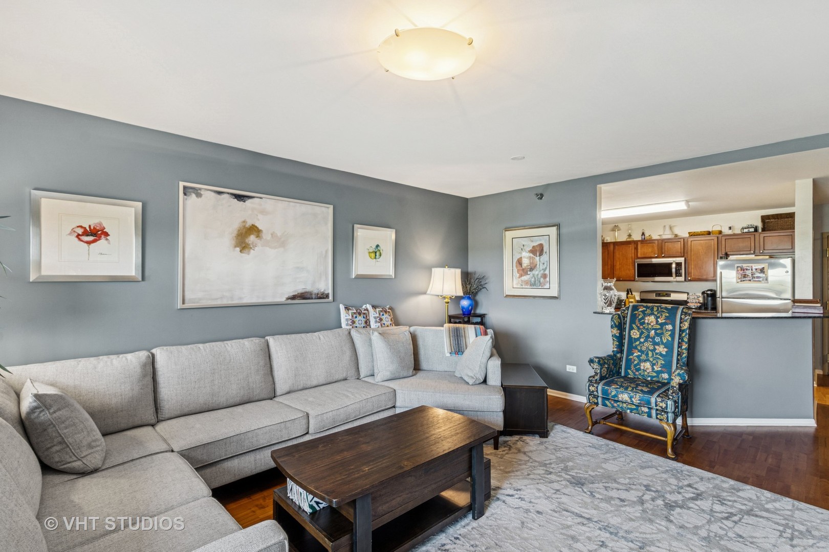 390 West Mahogany Court, Unit 606 Palatine, IL 60067 - Photo 4 of 27 a living room with furniture and a flat screen tv