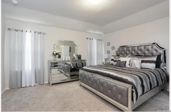 a bed room with a bed and a couch