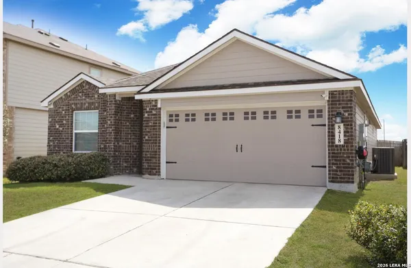 a front view of a house with garage