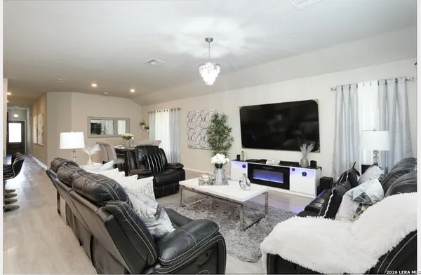 a living room with furniture and a flat screen tv