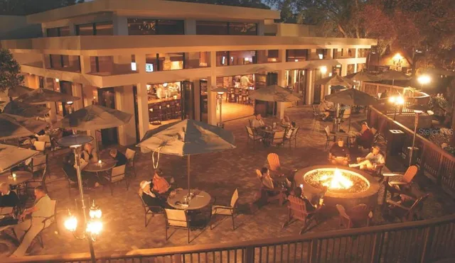 a view of swimming pool with outdoor seating and yard