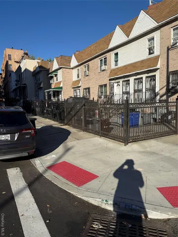 a view of a brick house with many windows