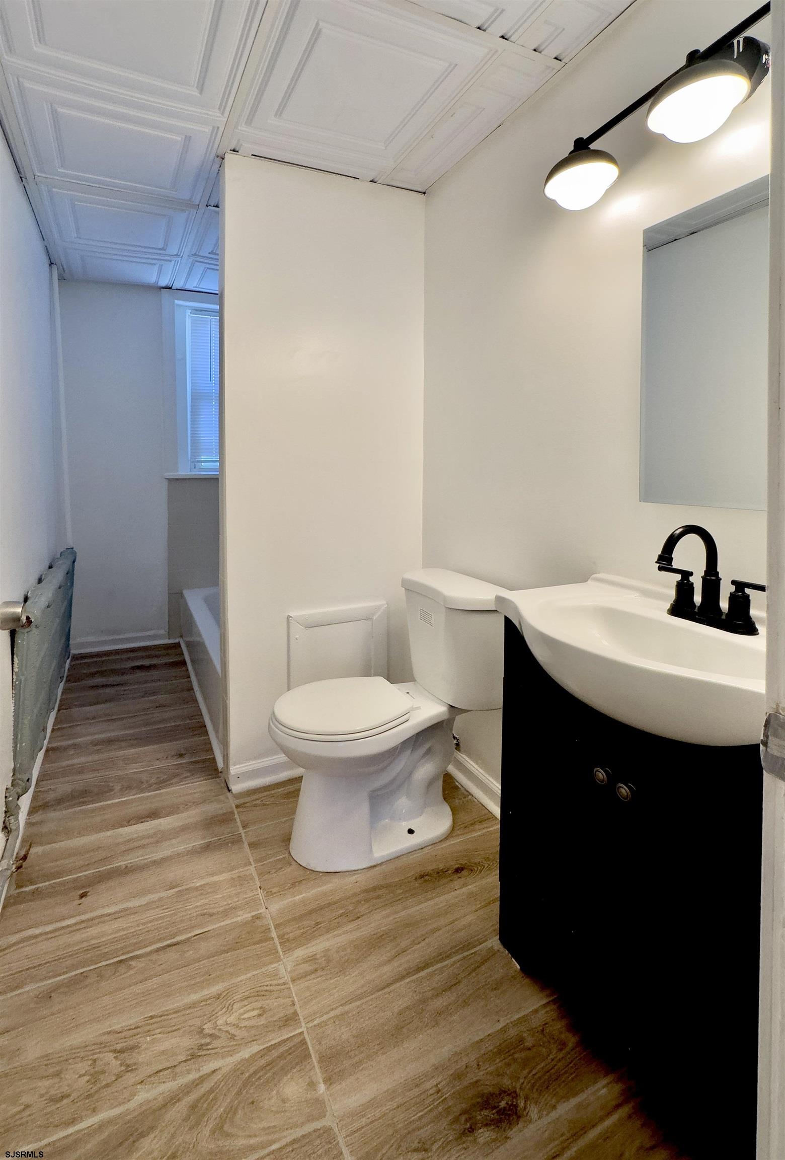 101 New Jersey Avenue, Unit A Atlantic City, NJ 08401 - Photo 8 of 13 a bathroom with a sink and a toilet