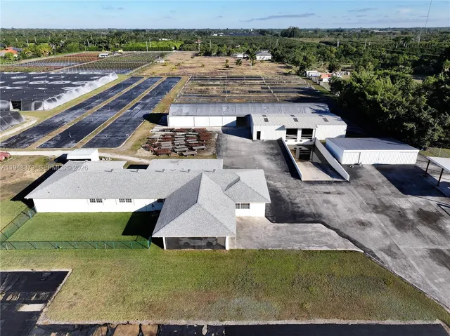 an aerial view of a house with outdoor space