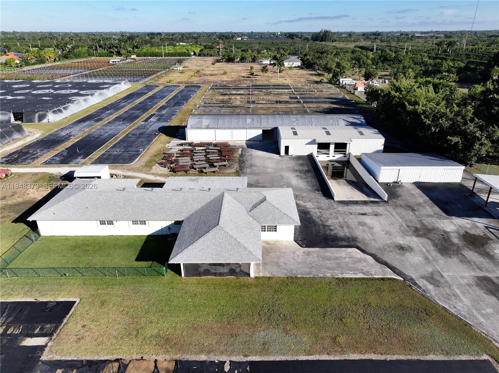 18455 Southwest 284th Street Homestead, FL 33030 - Photo 1 of 15 an aerial view of a house with outdoor space
