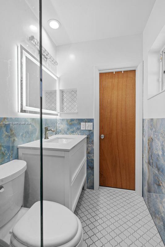 18455 Southwest 284th Street Homestead, FL 33030 - Photo 15 of 15 a bathroom with a sink a toilet and shower