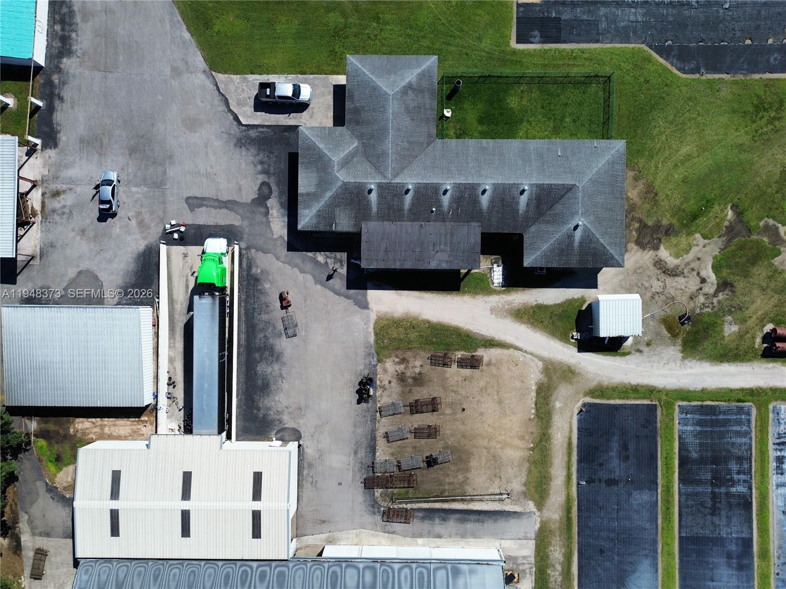 18455 Southwest 284th Street Homestead, FL 33030 - Photo 3 of 15 an aerial view of residential houses with outdoor space
