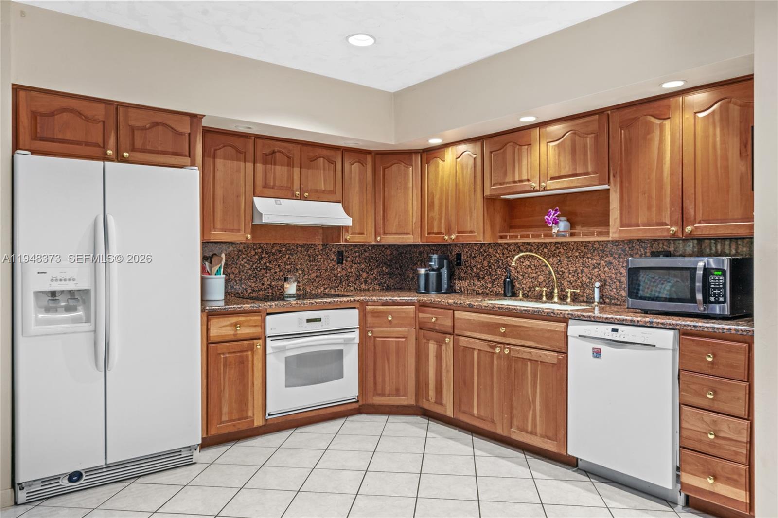 18455 Southwest 284th Street Homestead, FL 33030 - Photo 8 of 15 a kitchen with a sink cabinets and window