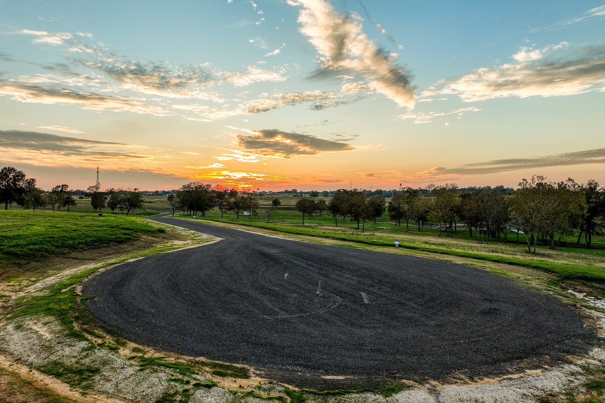 Tbd Tbd Sunny Meadow Drive Chappell Hill, TX 77426 - Photo 29 of 44 a view of a golf course with a lake
