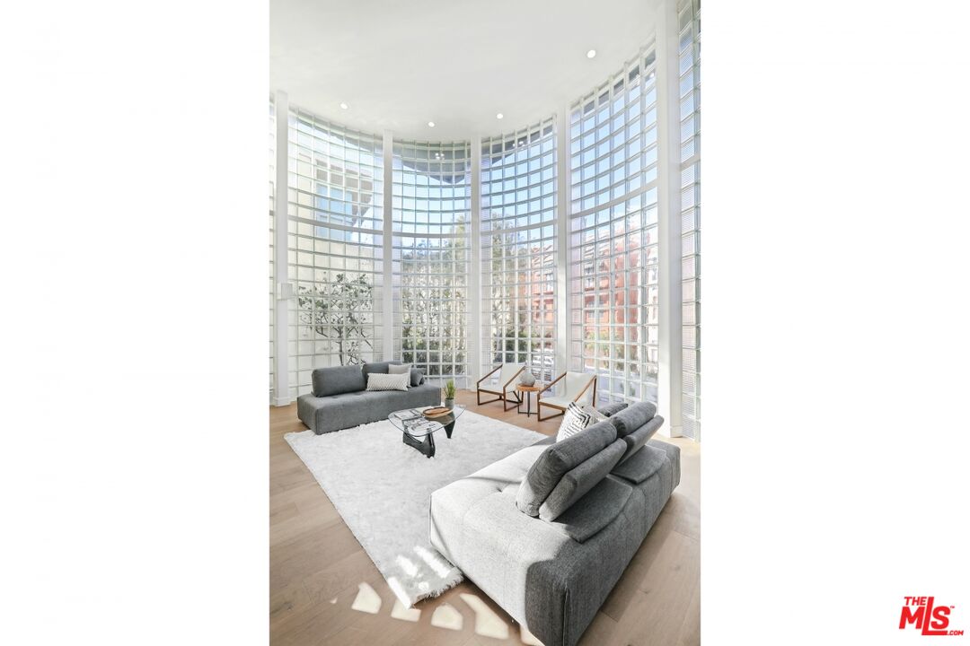 124 Roma Court Marina del Rey, CA 90292 - Photo 12 of 50 a living room with furniture and a large window