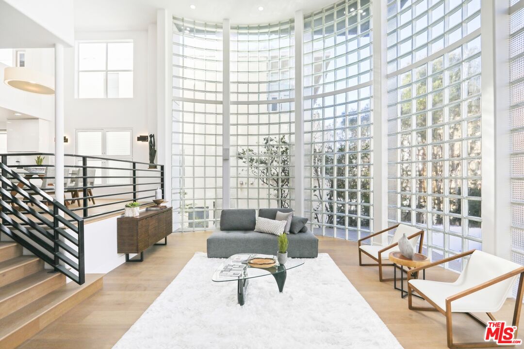 124 Roma Court Marina del Rey, CA 90292 - Photo 13 of 50 a living room with furniture and a large window