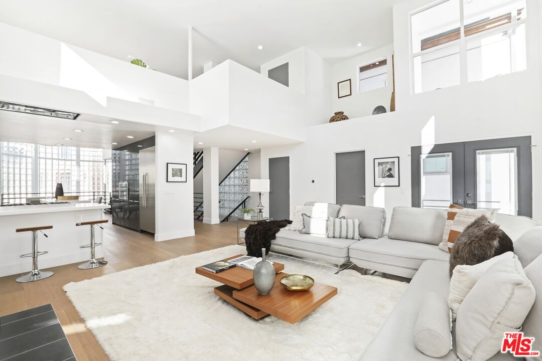 124 Roma Court Marina del Rey, CA 90292 - Photo 19 of 50 a living room with furniture kitchen view and a large window