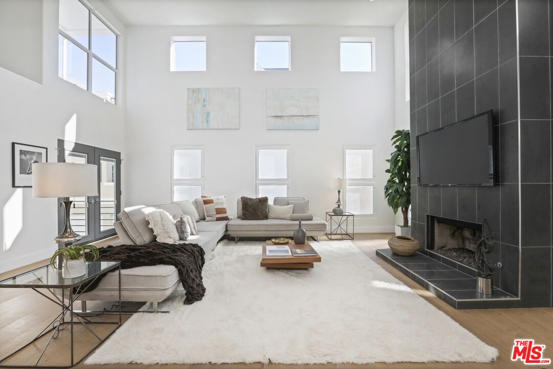 124 Roma Court Marina del Rey, CA 90292 - Photo 22 of 50 a living room with furniture and a fireplace