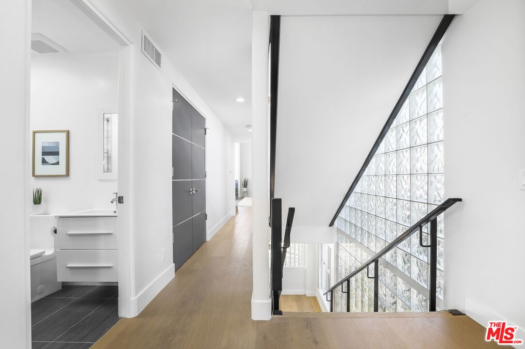 124 Roma Court Marina del Rey, CA 90292 - Photo 27 of 50 a view of entryway and hall with wooden floor