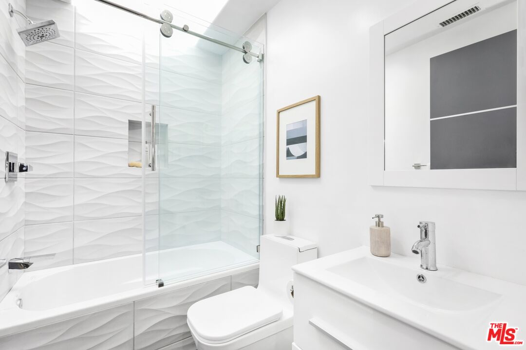 124 Roma Court Marina del Rey, CA 90292 - Photo 28 of 50 a bathroom with a sink toilet and shower