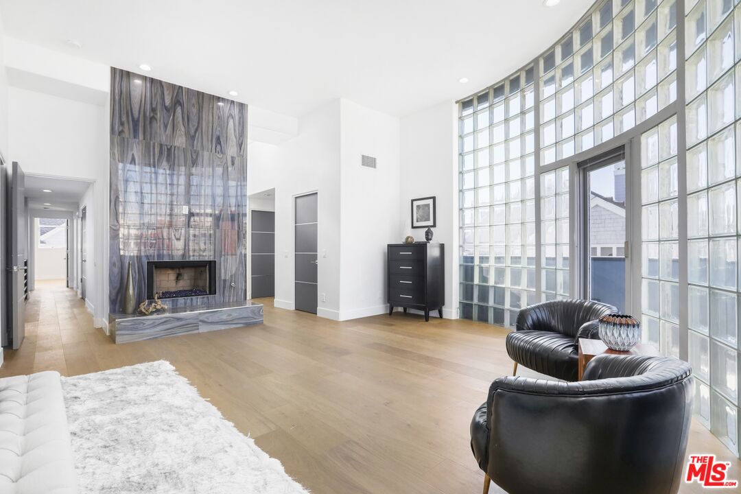 124 Roma Court Marina del Rey, CA 90292 - Photo 30 of 50 a living room with furniture and a fireplace
