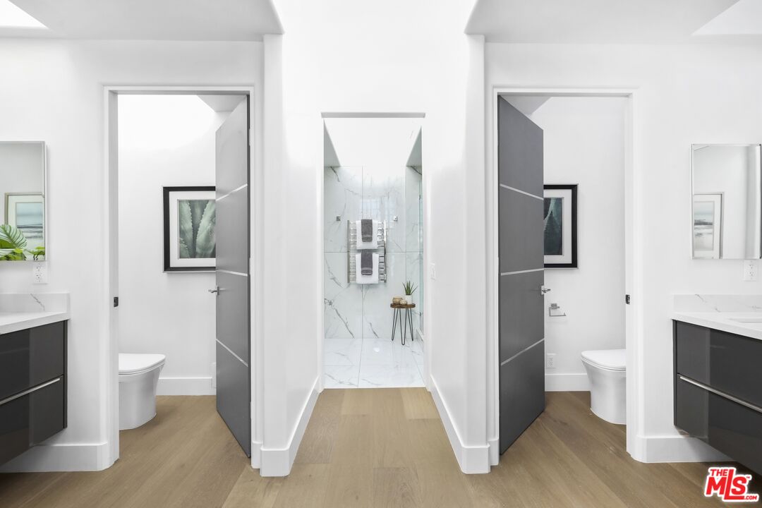 124 Roma Court Marina del Rey, CA 90292 - Photo 35 of 50 a bathroom with a toilet sink and mirror