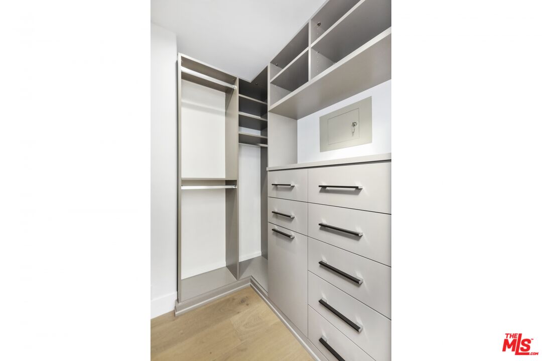 124 Roma Court Marina del Rey, CA 90292 - Photo 38 of 50 a view of an empty walk in closet with a bathroom