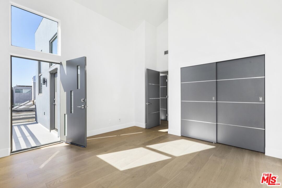124 Roma Court Marina del Rey, CA 90292 - Photo 39 of 50 a view of an empty room with cabinet and a window
