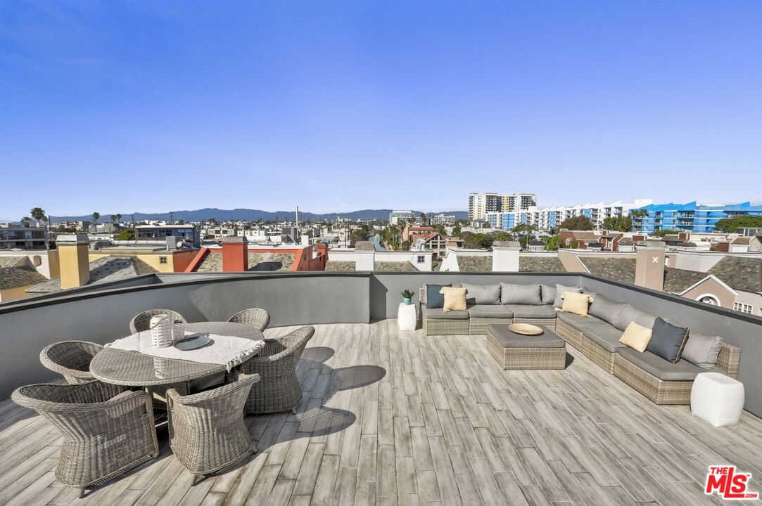 124 Roma Court Marina del Rey, CA 90292 - Photo 44 of 50 a balcony with a table and chairs