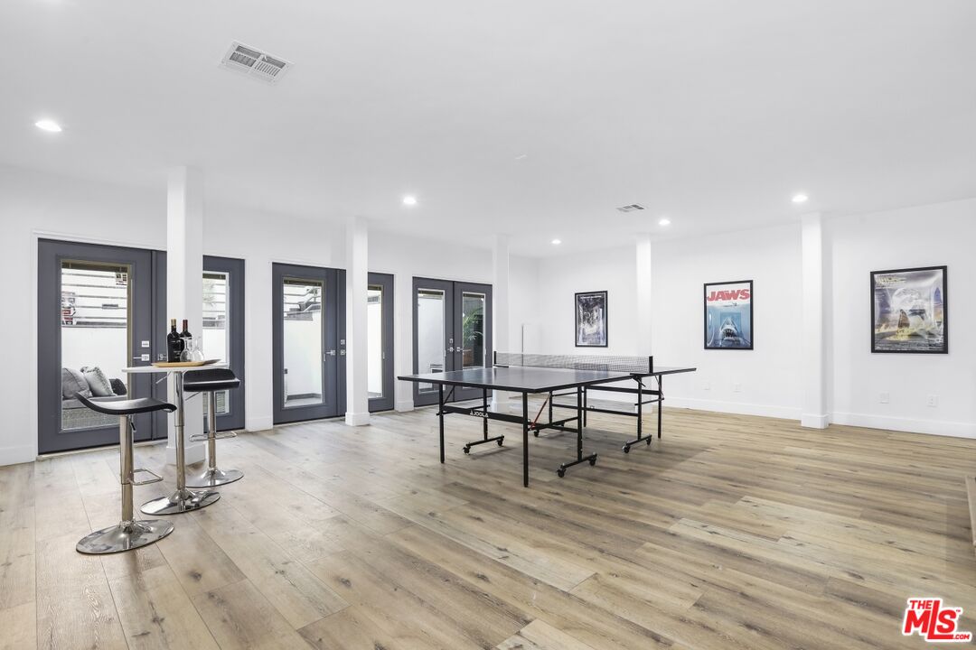 124 Roma Court Marina del Rey, CA 90292 - Photo 47 of 50 a view of a livingroom with furniture a table and wooden floor