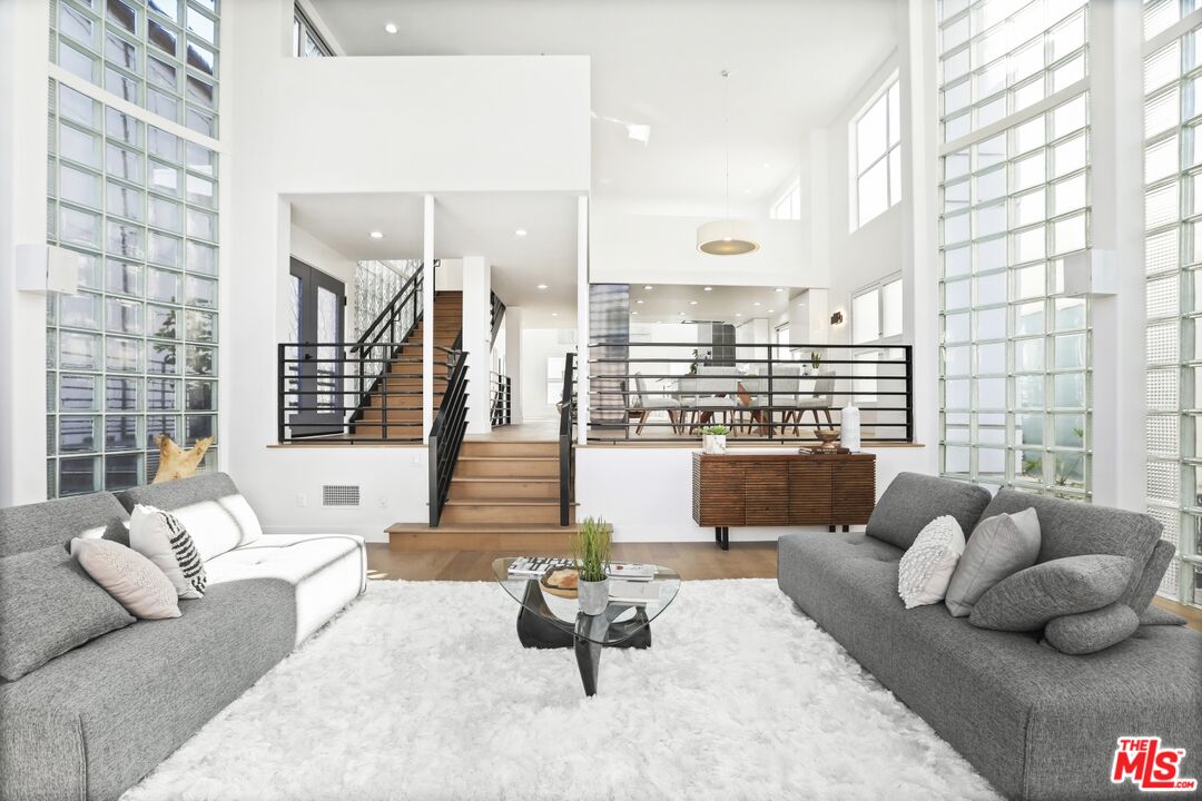 124 Roma Court Marina del Rey, CA 90292 - Photo 9 of 50 a living room with furniture and a large window