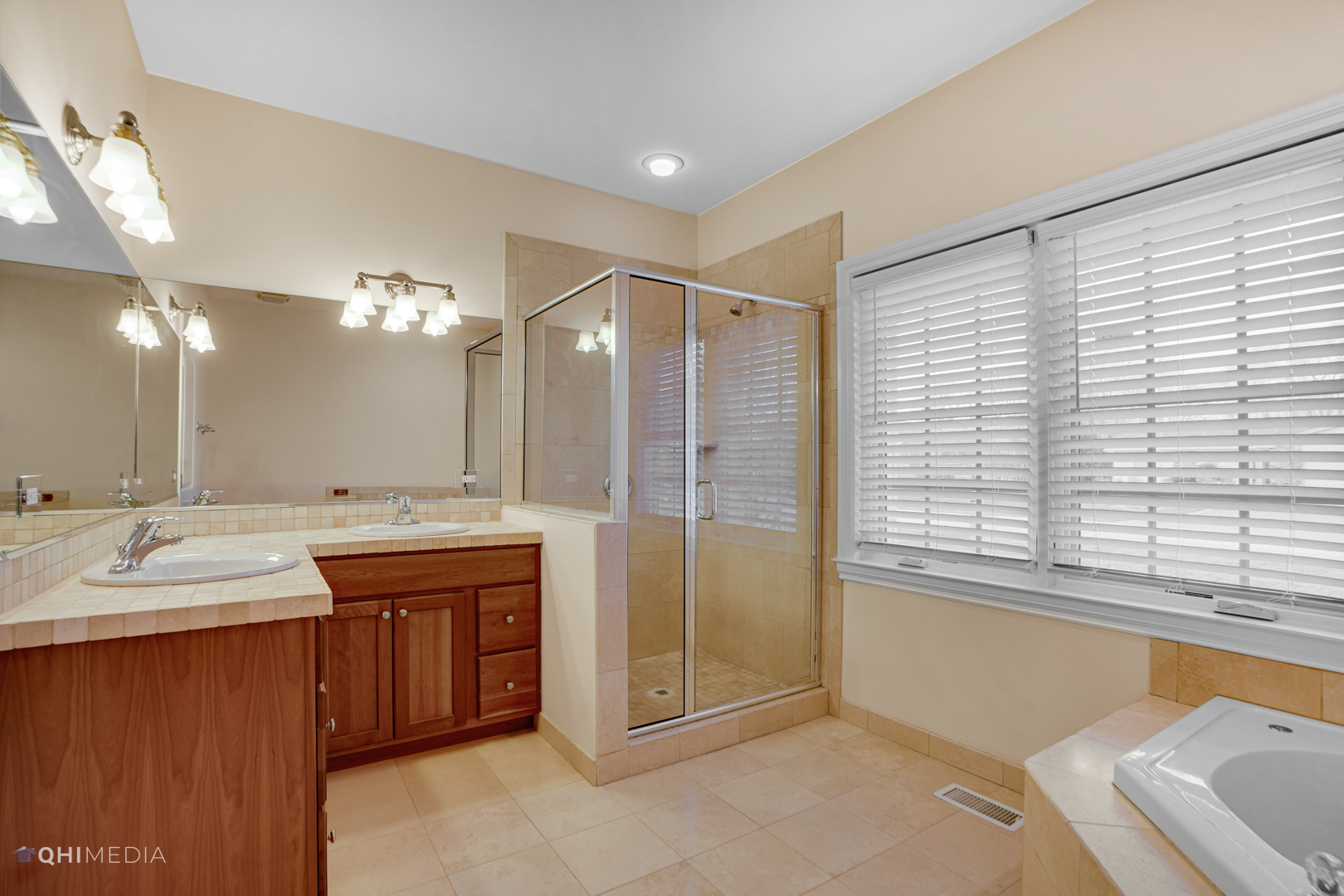 511 Russell Street Wheeling, IL 60090 - Photo 13 of 20 a bathroom with a double vanity sink and a mirror
