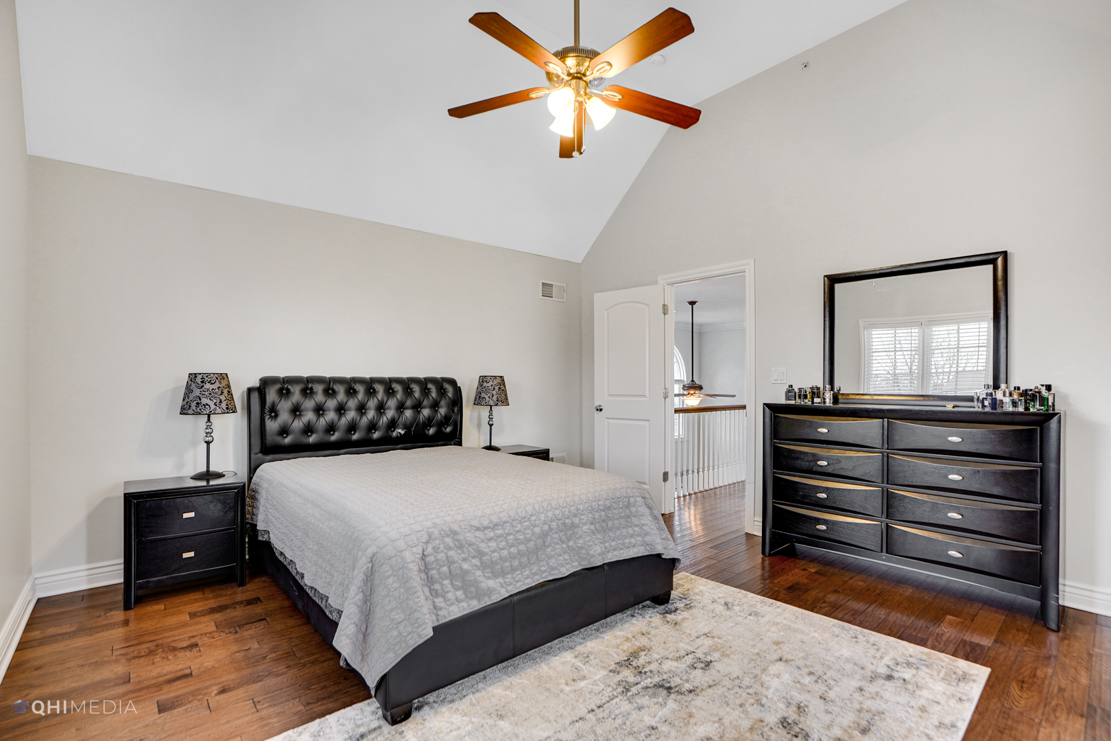 511 Russell Street Wheeling, IL 60090 - Photo 15 of 20 a bedroom with a bed and a chandelier fan