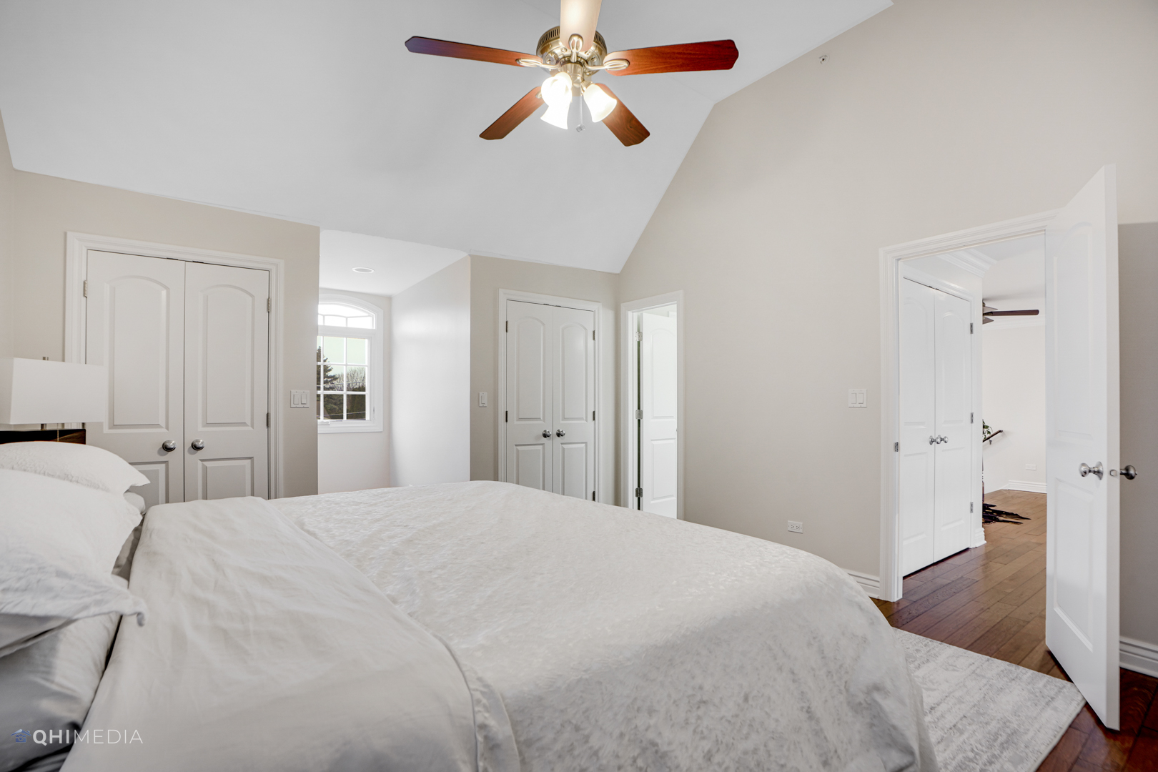 511 Russell Street Wheeling, IL 60090 - Photo 16 of 20 a bedroom with a bed and a chandelier