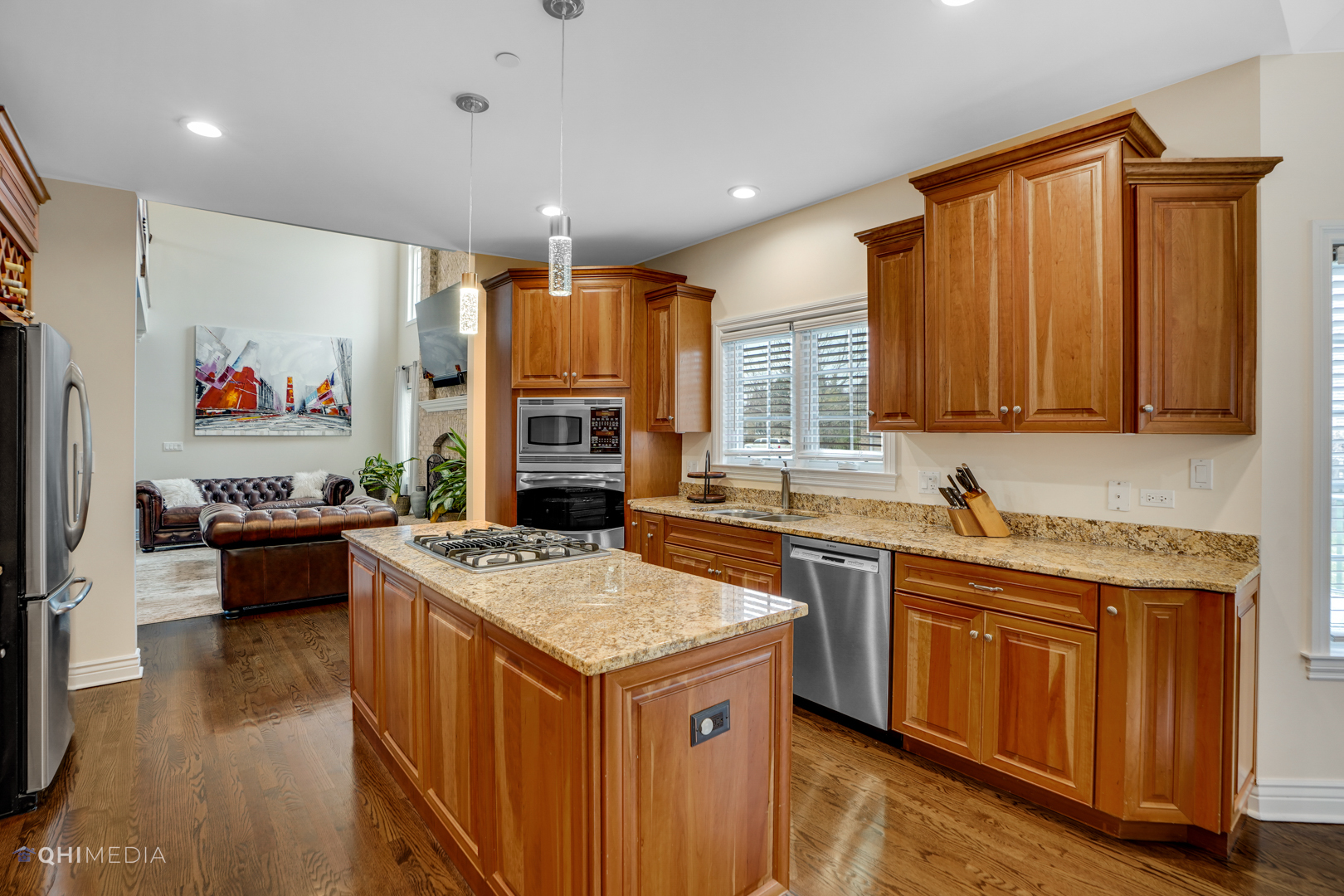 511 Russell Street Wheeling, IL 60090 - Photo 6 of 20 a kitchen with a stove a sink a refrigerator and wooden cabinets